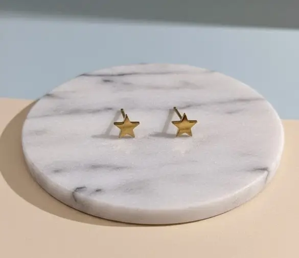 Topo Estrella dorado